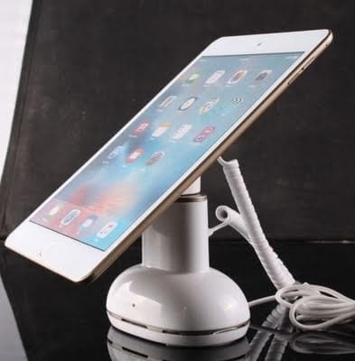 White security stand holding an iPad with an anti-theft cable attached