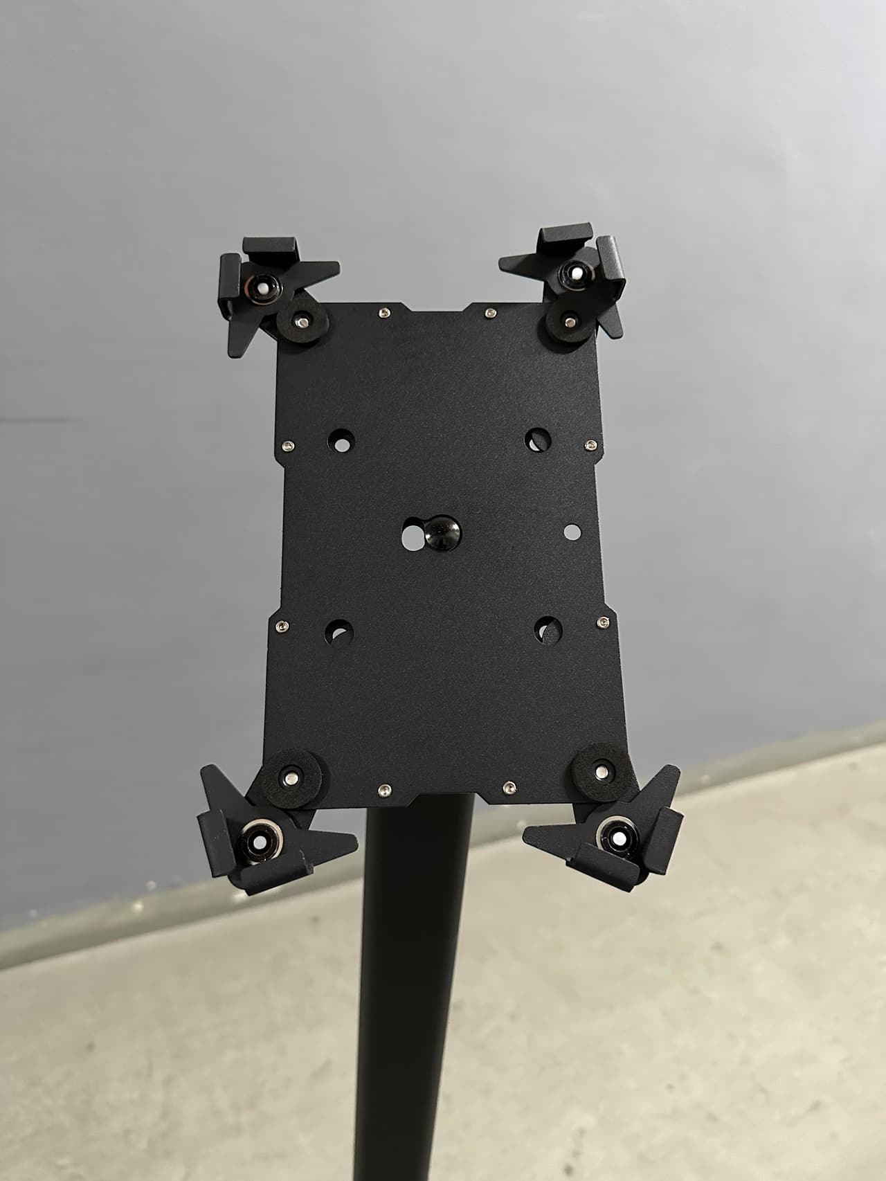 Close-up of the adjustable clamp bracket that grips and locks the iPad